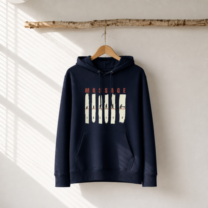 Sweat à capuche bio Massage Is Life, design évolution humoristique, suspendu sur cintre en bois, lumière naturelle