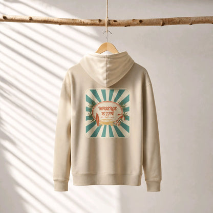 Sweat à capuche bio beige avec logo 'Massage Is Life', design soleil et palmiers, suspendu à une branche