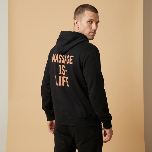 Sweat à capuche noir bio avec inscription 'MASSAGE IS LIFE' dos, style bien-être et lifestyle