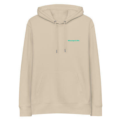 Sweat à capuche beige bio avec inscription 'Massage is life' en vert clair, style lifestyle bien-être.